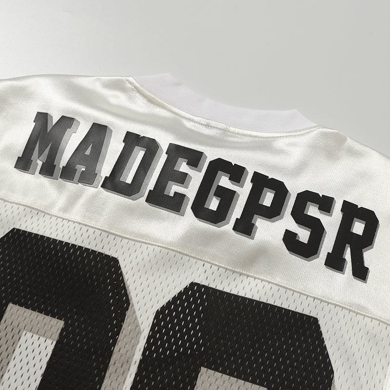 White mesh panel football jersey tee with MADEGPSR lettering and large black number 06 on the back