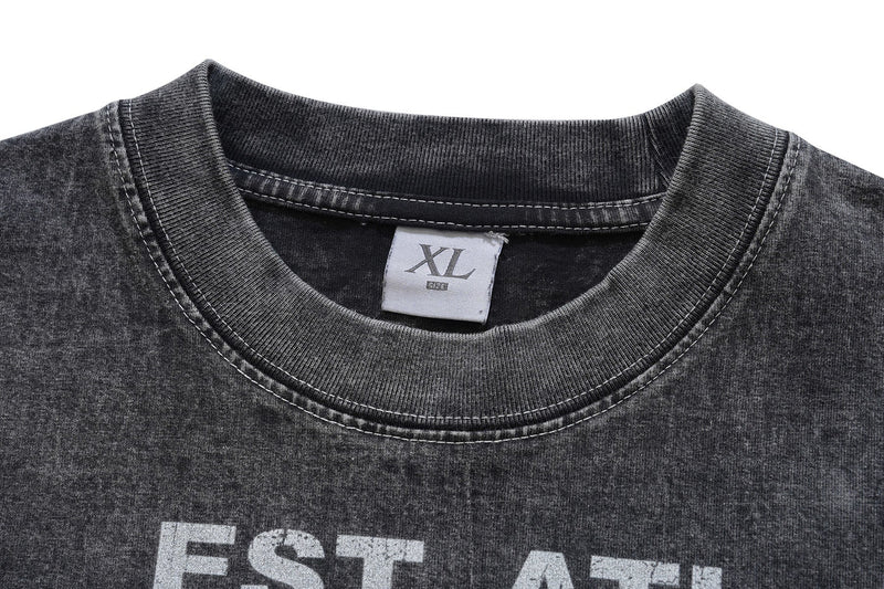Vintage washed black graphic tee with ribbed crew neck and XL label, featuring distressed Atlanta print