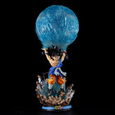 The Seakoff Goku Collectible Figure – Dragon Ball Z Kamehameha Statue is a 46cm premium action figure showcasing Goku with spiky black hair in his orange and blue outfit, holding a large translucent blue orb above rocky terrain with smaller figures, capturing the iconic Kamehameha wave moment.