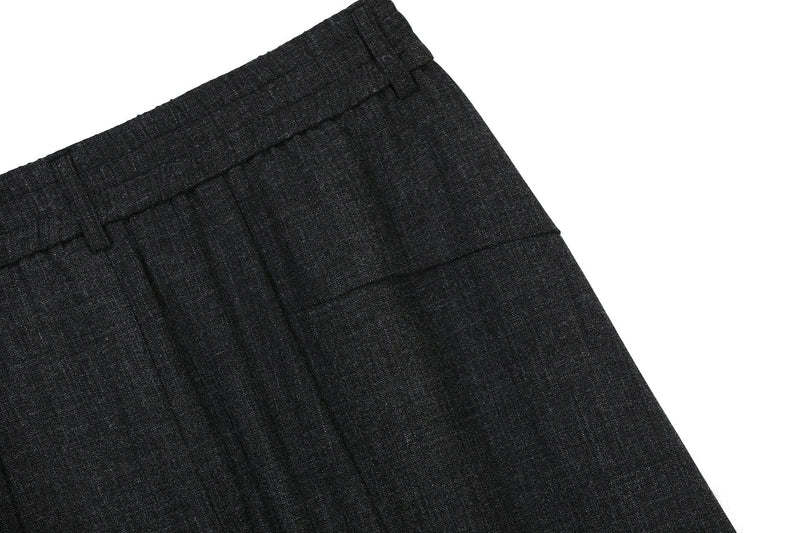 Close-up of black pants hem with smooth wide-leg fabric