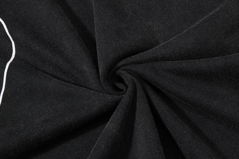 Black washed streetwear tee with spiral-fold texture and white graphic trim along the edge