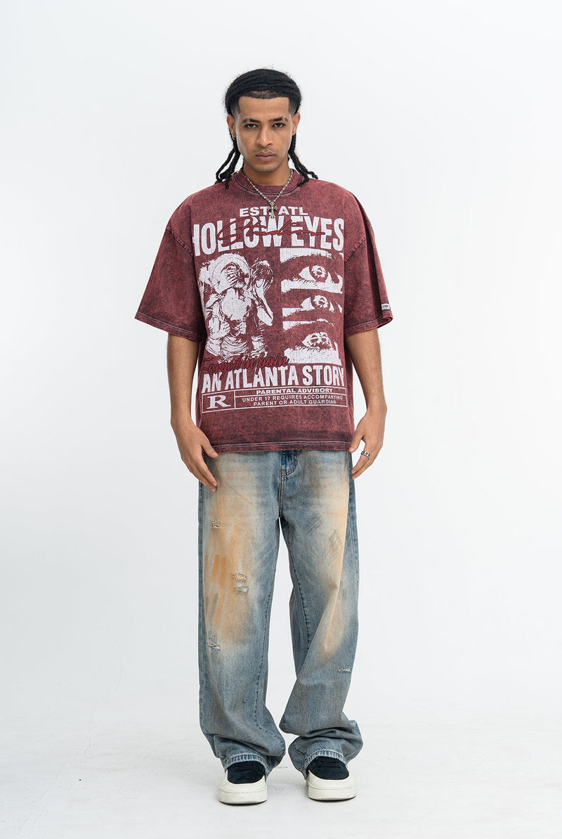 Vintage washed burgundy graphic tee with Atlanta Story print, worn with baggy faded jeans on a male model