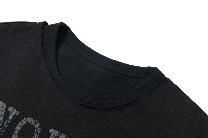 Washed black distressed graphic tee with layered neckline and faded print detail
