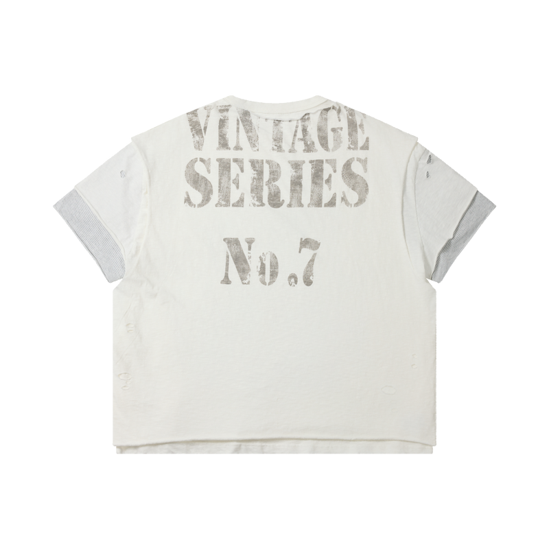 White distressed graphic tee with vintage series No. 7 print and layered short sleeves on black background