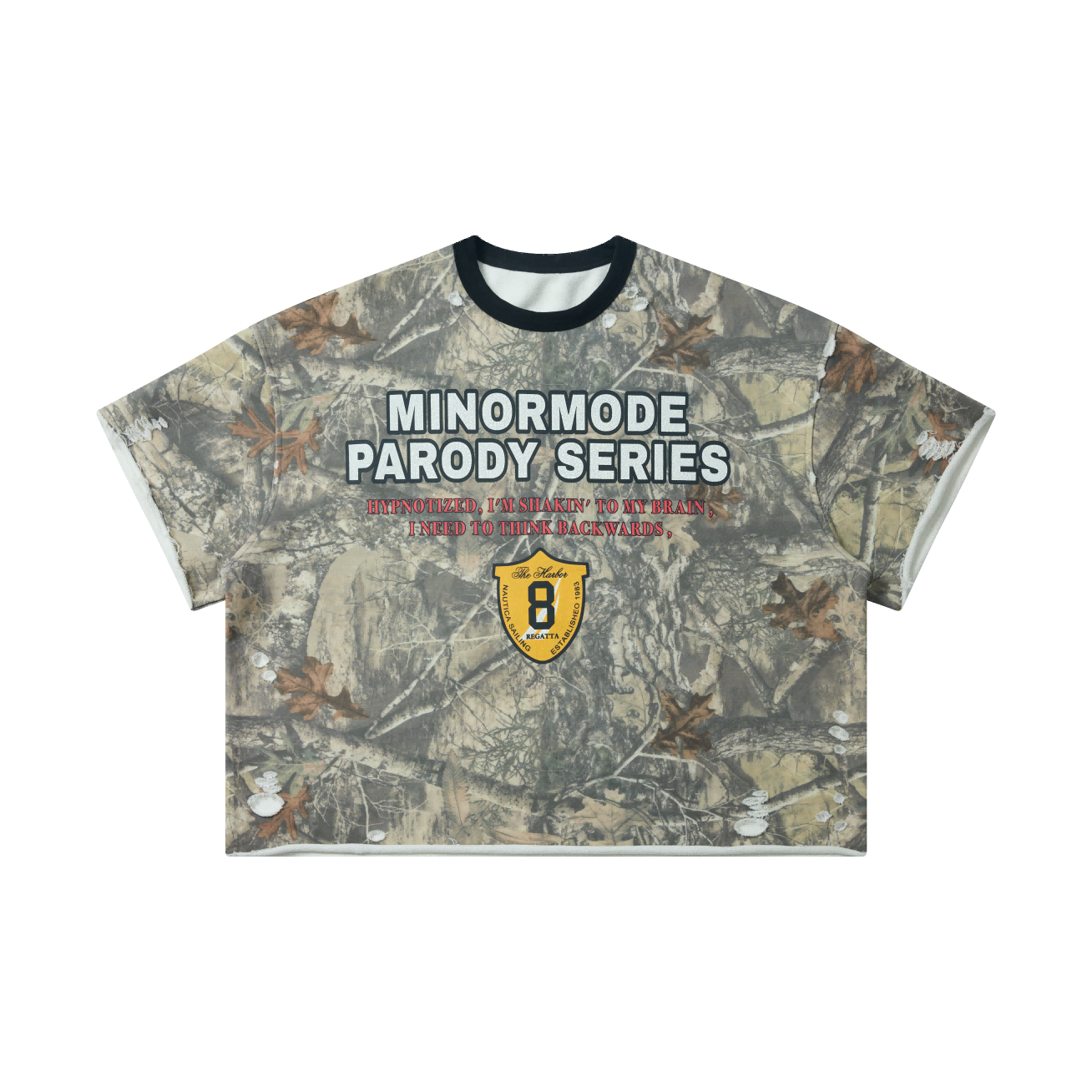 Front view of a woodland camo crop tee with Minormode Parody Series varsity graphic and nautical shield badge