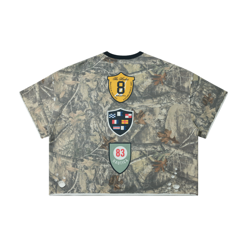 Woodland camo crop tee with three crest graphics on the back, short sleeves, and a relaxed boxy fit