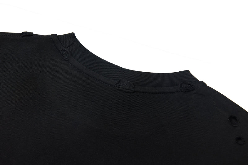 Black tee crewneck seam and distressed neckline close-up