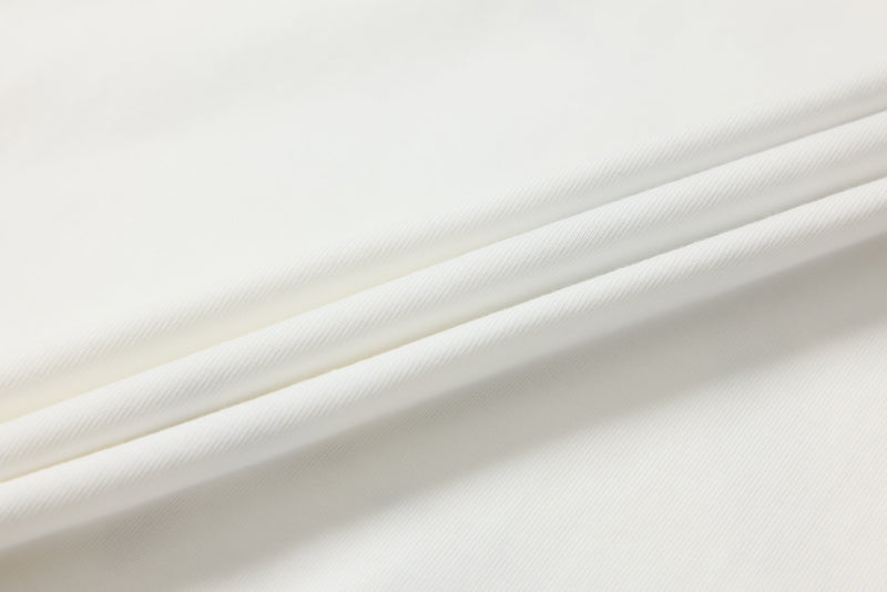Close-up of white tee fabric drape with soft ribbed texture