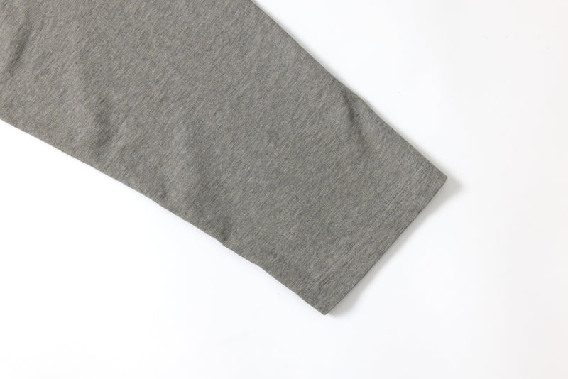 Close-up of the gray sleeve cuff on the long sleeve tee