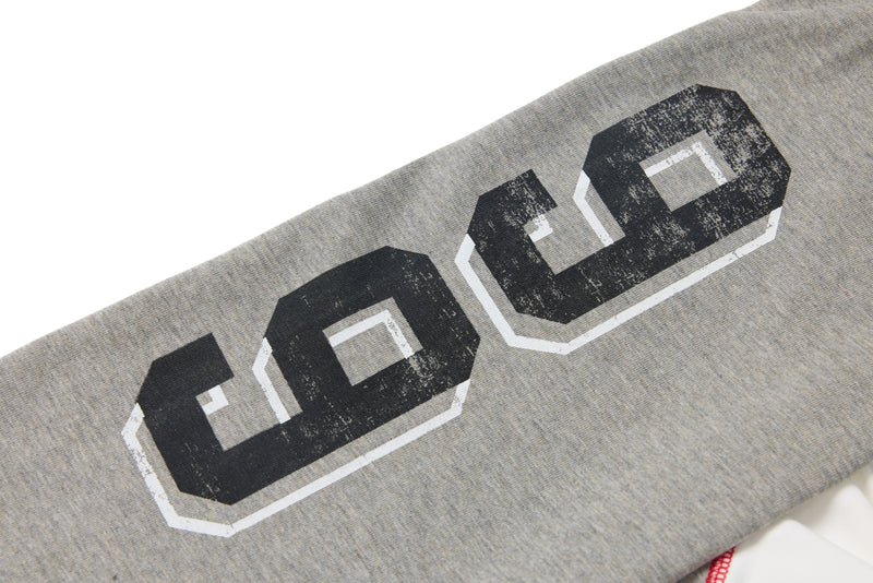 Close-up of the gray sleeve with large black printed number graphic