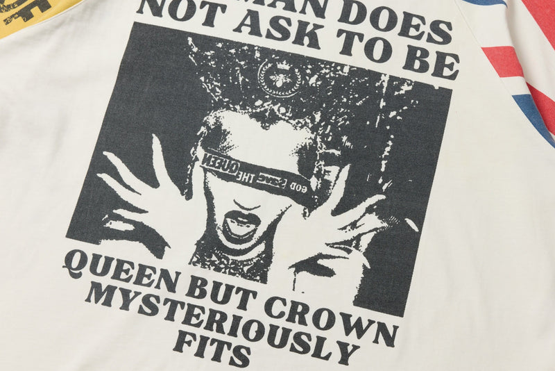 Front graphic print on white long sleeve tee showing bold black text and a distressed face design