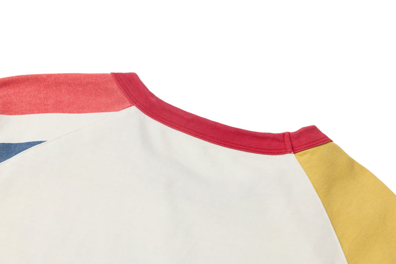 Back shoulder detail of white raglan tee with red neckline, yellow sleeve, and visible blue graphic edge