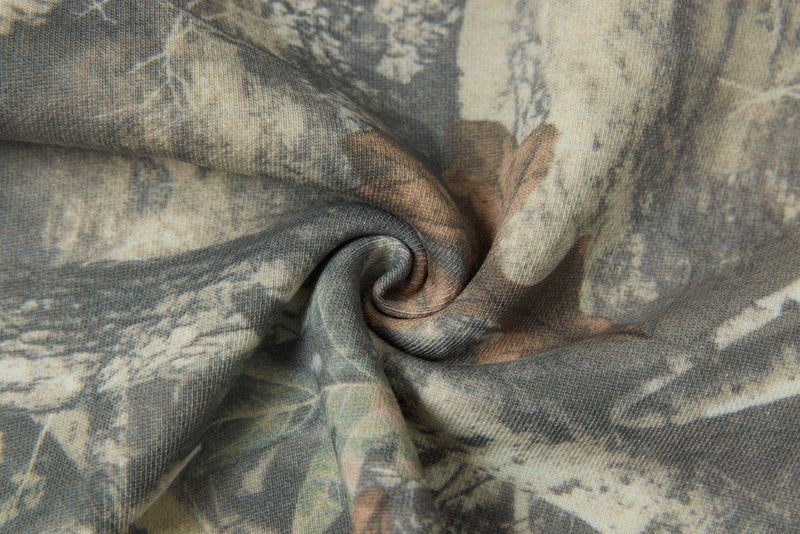 Close-up of woodland camo fabric with a soft, heathered texture for a graphic crop tee