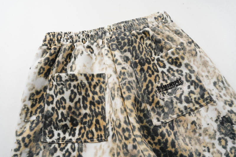 Back view of leopard print pants showing both patch pockets and loose fit