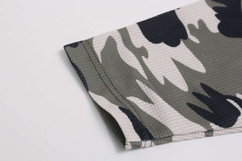 Close-up of sleeve cuff on camo waffle long sleeve top with stitched hem
