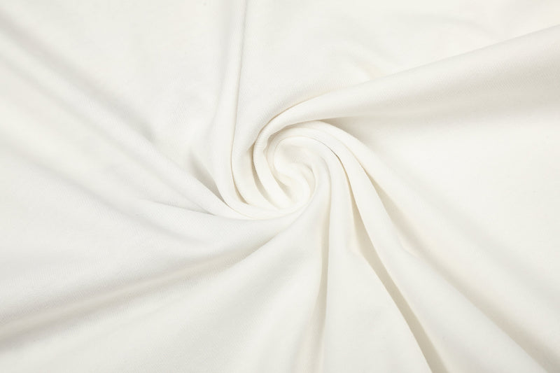 Rolled cream fabric detail showing smooth knit texture