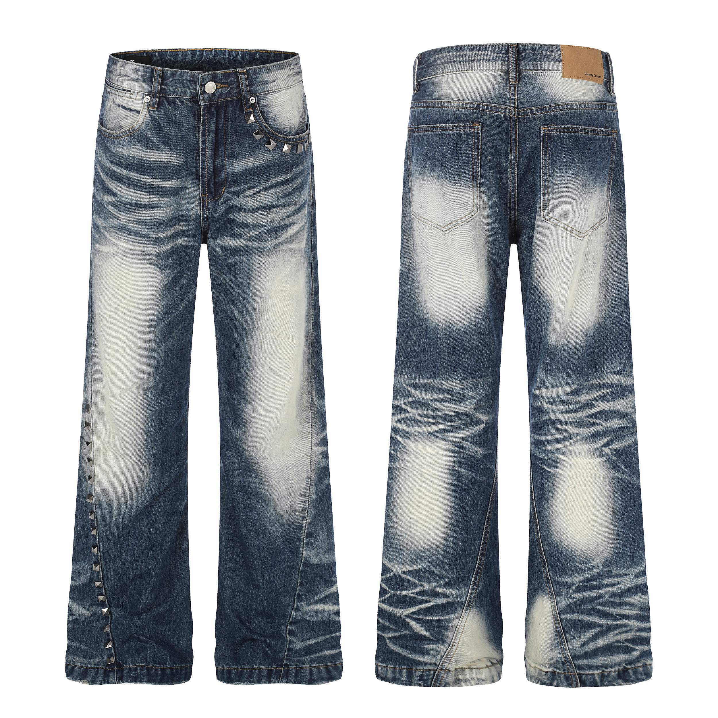 Front and back view of Omirad studded vintage wash jeans with pyramid stud side seams and heavy whisker fade denim