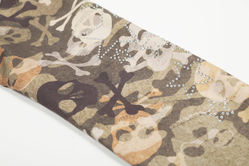 Close-up of sleeve with rhinestone star details on camouflage jacket