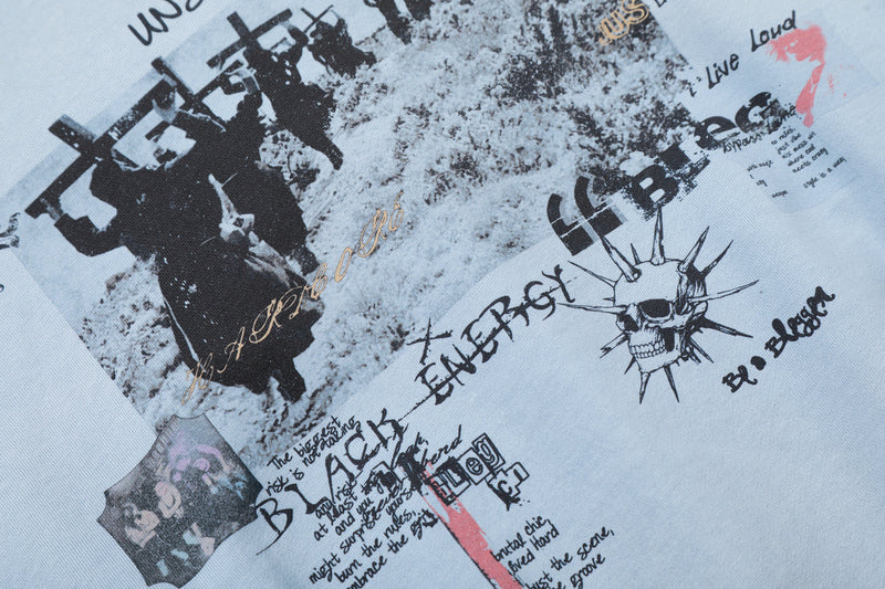 Close-up of back graphic on light blue zip-up hoodie with skull and text print