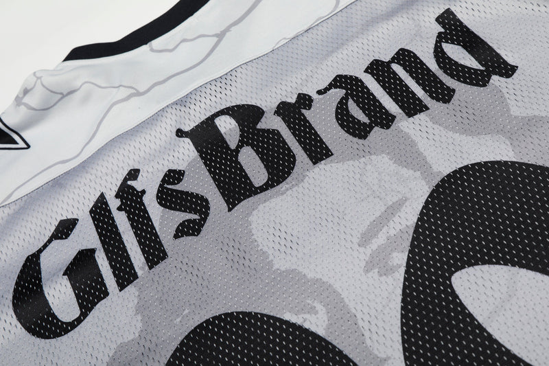 Close-up of a white mesh football jersey with bold black GlfsBrand graphic and number 99 print