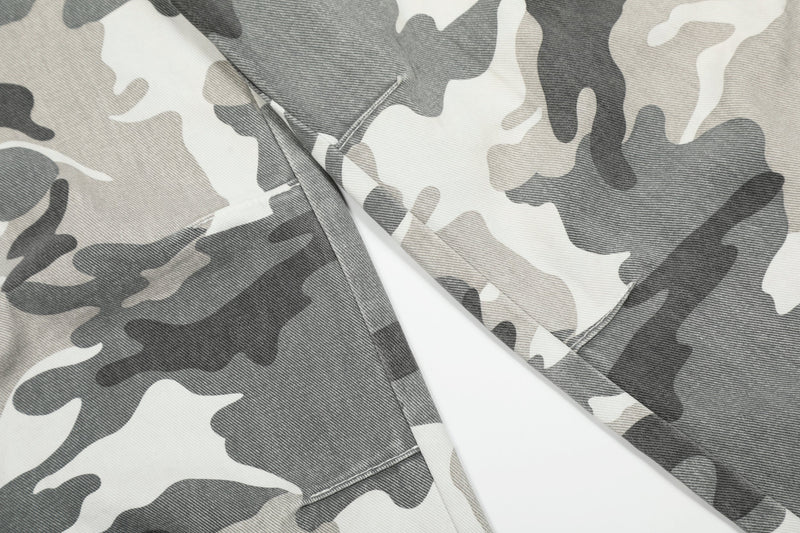Close-up of the upper leg and knee area on gray camo cargo pants