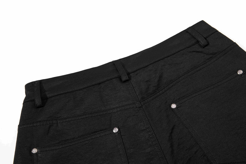 Back waistband of black wide-leg pants with belt loops and back pocket hardware