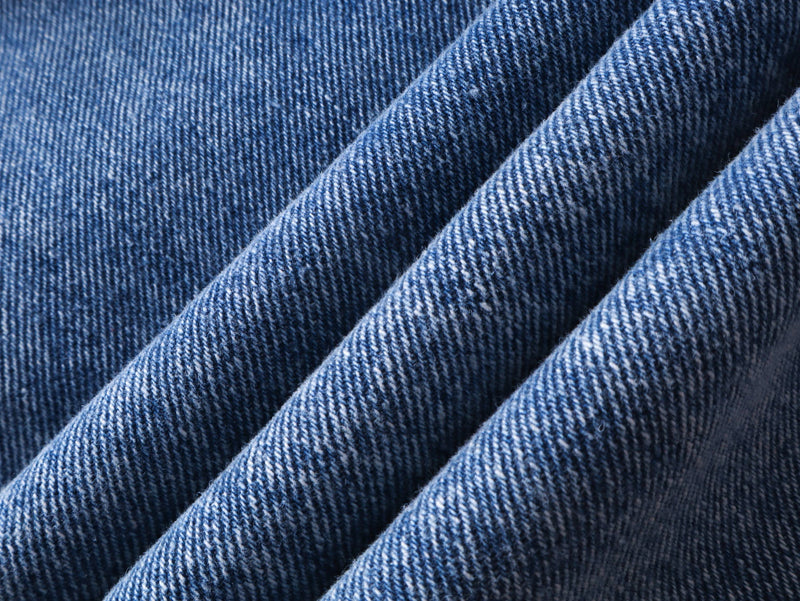 Close-up of blue denim fabric folds and texture