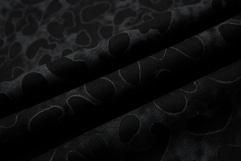 Black leopard mesh fabric with layered sheer texture for a varsity streetwear graphic T-shirt