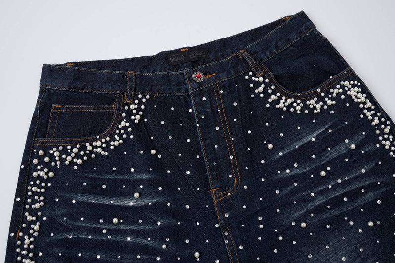 Front upper section of black denim shorts with pearl stud accents