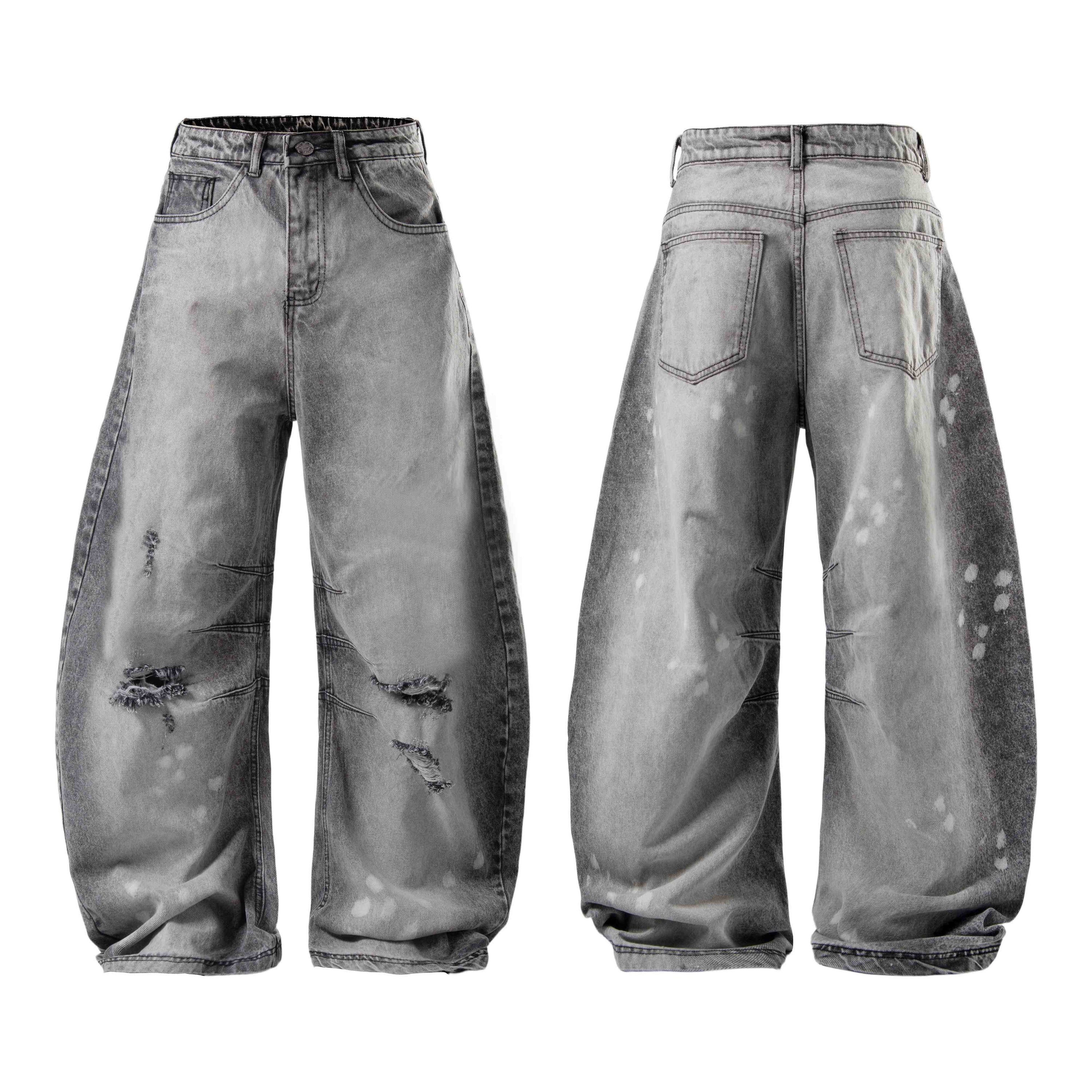 Front and back view of grey washed baggy wide-leg jeans with distressed knee rips and paint splatter details