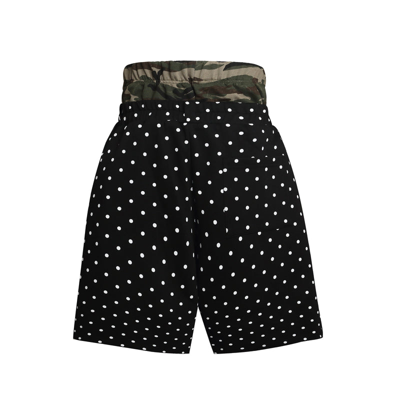 Back view of black polka dot shorts with camo waistband and a rear patch pocket