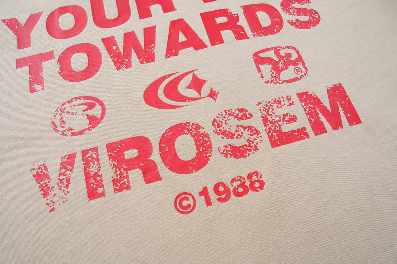 Cream streetwear T-shirt with bold distressed red graphic text and logo print across the chest