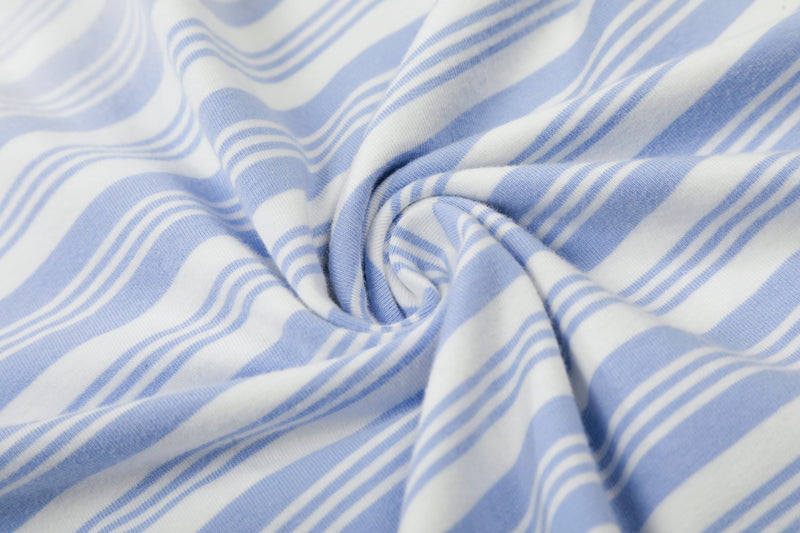 Knotted close-up of light blue and white striped polo shirt fabric