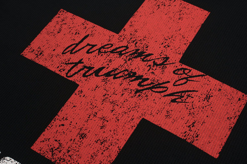 Red distressed cross graphic on black tee with handwritten streetwear typography