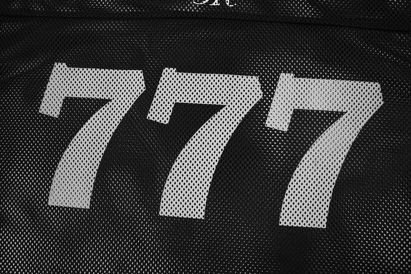 Black mesh football jersey with large white 777 graphic on the back, styled for streetwear and sportswear