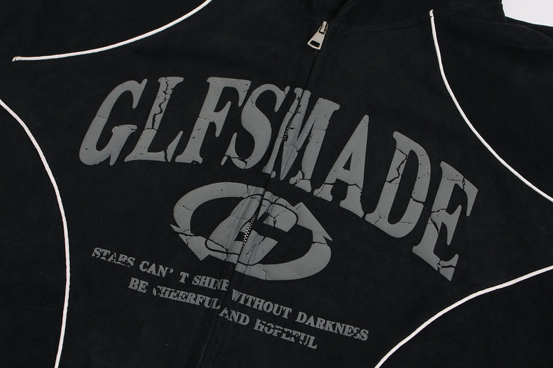 Close-up of black hoodie front graphic and center zipper