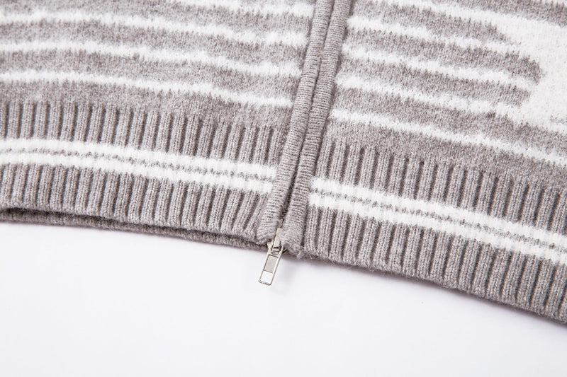 Close-up of the jacket hem with zipper and ribbed knit trim