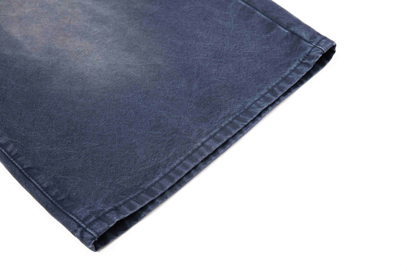 Close-up of dark wash denim shorts hem and leg opening