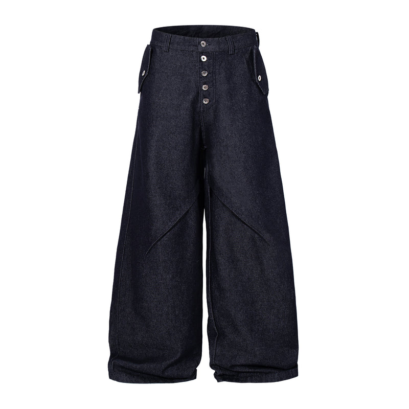 Front view of dark indigo wide leg denim pants with panel seams and button fly