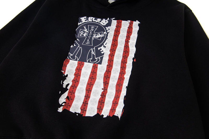 Close-up of front graphic on black pullover hoodie with distressed flag design