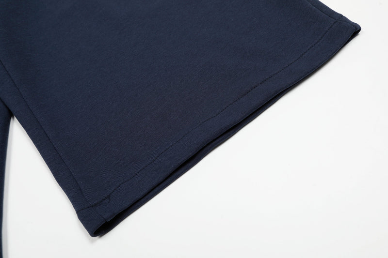Navy shorts hem close-up with straight stitched edge