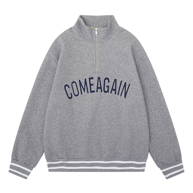 Gray half-zip mockneck sweatshirt with navy arched COMEAGAIN lettering and striped hem and cuffs