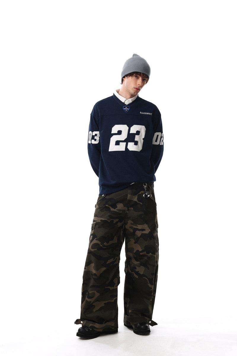 Navy long sleeve tee worn with white number 23 and sleeve numbers, full-body view