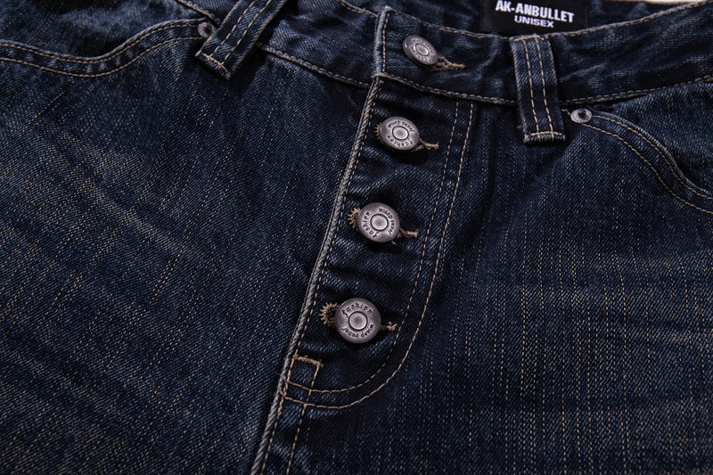 Close-up of the front fly on dark wash jeans with four-button closure