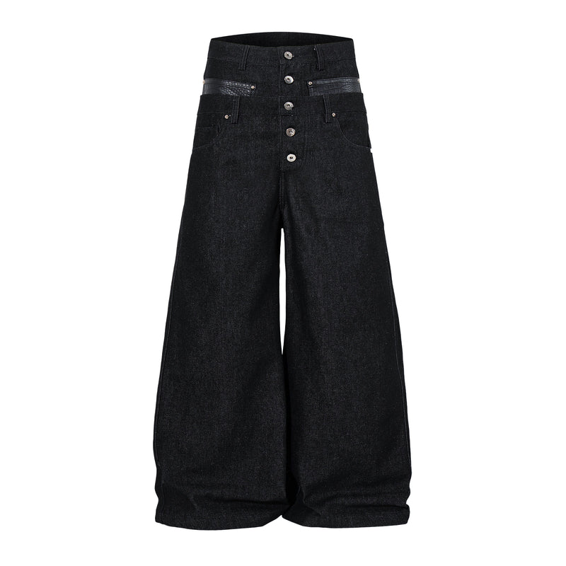 Front view of black wide-leg denim pants with high waist, button fly, and faux crocodile pocket trim