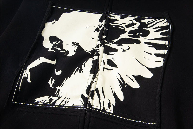 Close-up of white skull graphic printed on the front chest panel