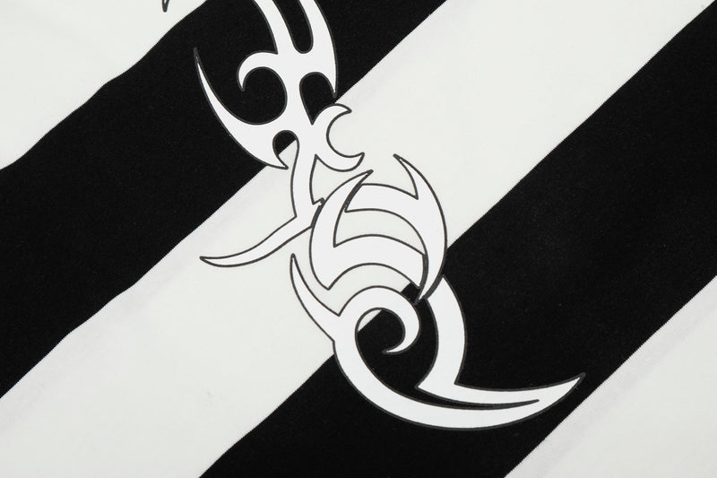 Black and white rugby stripe polo shirt with bold graphic logo print on the chest