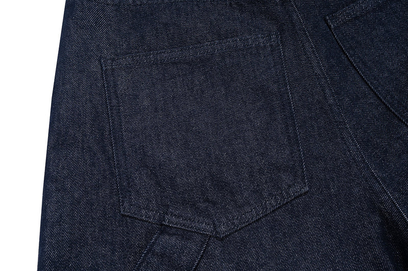 Close-up of back patch pocket on dark indigo denim cargo shorts