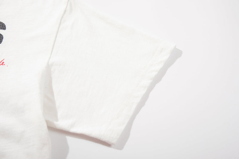 White graphic streetwear T-shirt with soft cotton sleeve detail and partial punk-style print on the chest