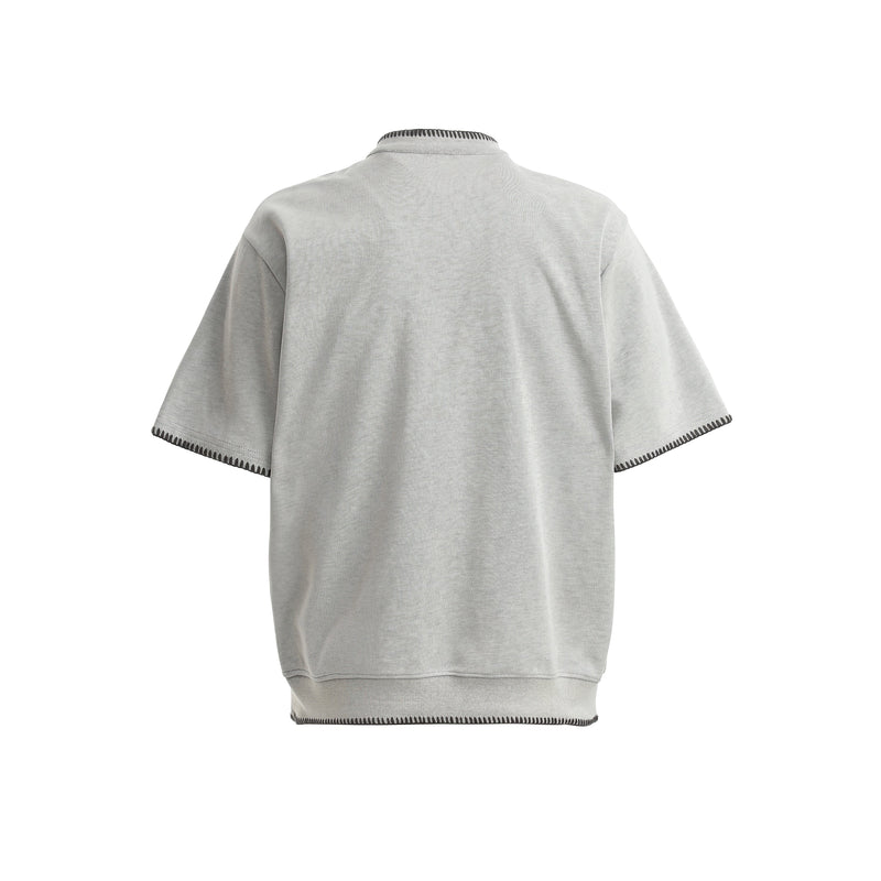 Light gray relaxed fit Henley tee with contrast stitching, short sleeves, and ribbed neckline shown from the back
